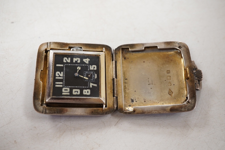A George V silver and blue guilloche enamel travelling folding timepiece, maker SSM, Birmingham, 1931, with Arabic dial and subsidiary seconds, case diameter 37mm, enamel a.f.